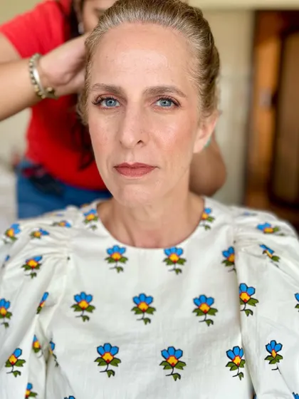 A behind-the-scenes glimpse of the daytime makeup application, showing the soft, natural tones used to create this fresh look.