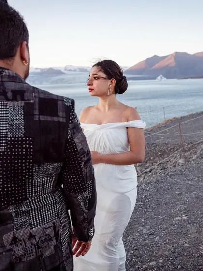 For their Iceland pre-wedding shoot, we styled Abhishek in a playful, printed Troy Costa blazer that had hints of white to coordinate with Shree's ethereal Gaurav Gupta gown.