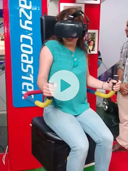 Here is one of our riders fully immersed in the Crazy Coaster VR experience. With the headset on and hands on the controls, she is navigating thrilling twists and drops, all while our motion-sync chair brings the virtual world to life. We are always on hand to ensure a safe and exciting adventure.