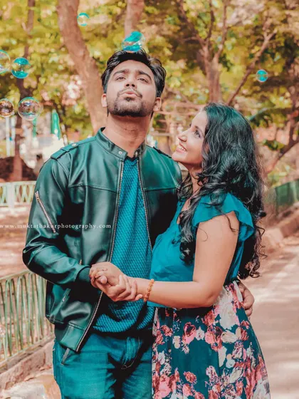 A candid moment of wonder and fun during a pre-wedding shoot in a park. I love using simple props like bubbles to create a dreamy and joyful atmosphere.
