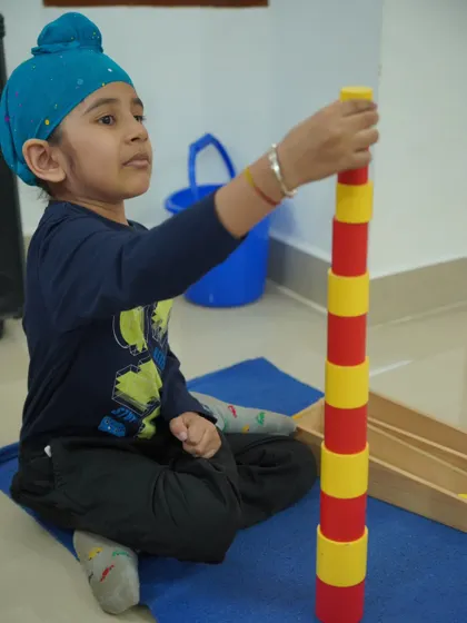 The Colored Cylinders are a classic sensorial material that helps children refine their visual discrimination of both height and diameter. This activity strengthens hand-eye coordination, concentration, and pre-math skills.