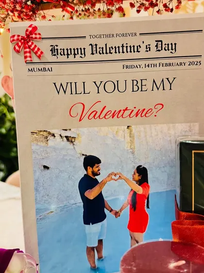 The custom Valentine's newspaper, featuring the couple's photo, is the headline of this romantic gift.