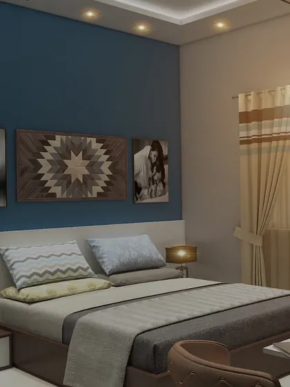 A personalized bedroom design featuring a blue accent wall with family photos. The room includes a custom bed and a compact vanity table, creating a comfortable and intimate space.