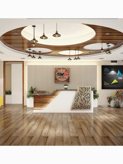 The reception area is the first impression of a business. For SVG Exports, we designed a welcoming yet professional entrance featuring a custom desk with patterned CNC-cut panels, a unique circular ceiling design with wood accents, and strategic lighting to create a memorable entry experience.