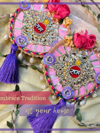 A soft pink "Ram Ram" hanging with purple tassels, this design offers a modern and elegant way to embrace tradition.