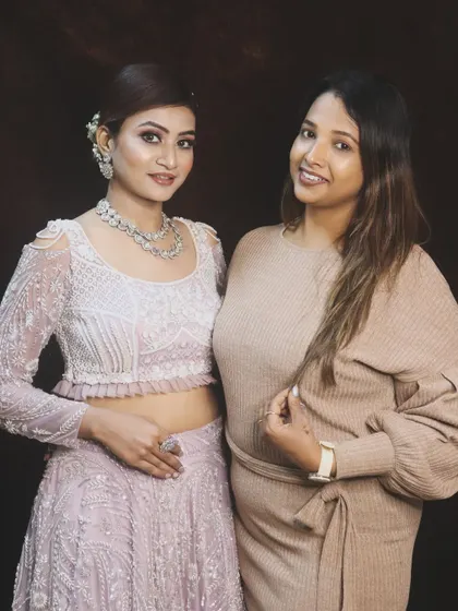 A shot of our artist with the model, showcasing the beautiful final look. We love collaborating with our clients to bring their vision to life.