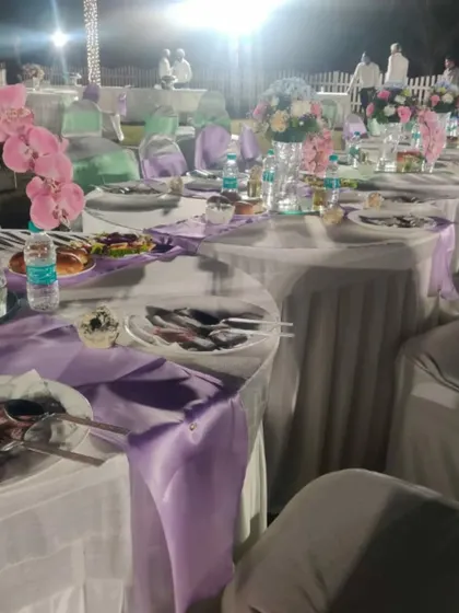 A beautifully set table at a wedding we catered at the ASC Centre. We provide complete service, including floral arrangements and coordinated table settings for a formal dinner.