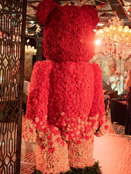 A life-size Bearbrick made entirely of fresh red and white roses welcomed guests to this Sangeet. This is how we infuse fun, art, and personalization into our events.