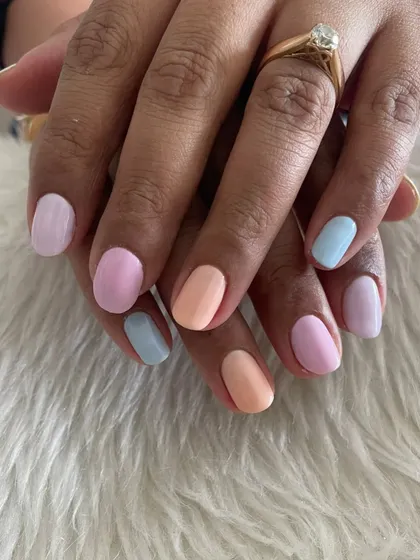 A fun pastel skittle manicure, with each nail painted a different soft shade.