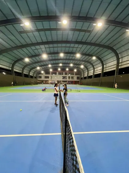 Our state-of-the-art covered hard courts in Bangalore, illuminated for a night session. This world-class facility ensures that our players' training is never interrupted by weather, providing a professional environment for them to thrive year-round.