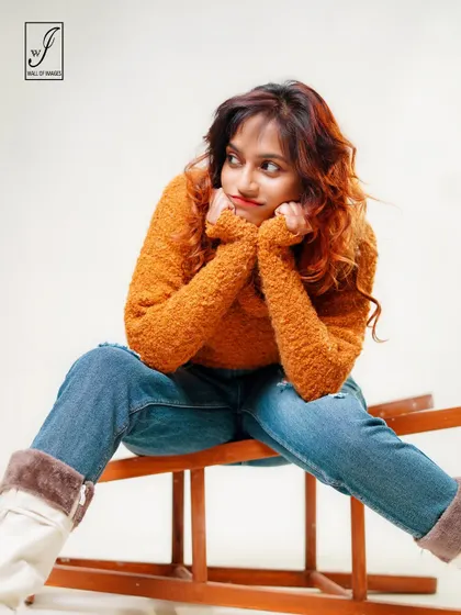 A thoughtful, daydreaming pose that adds a touch of softness and charm to the portfolio.