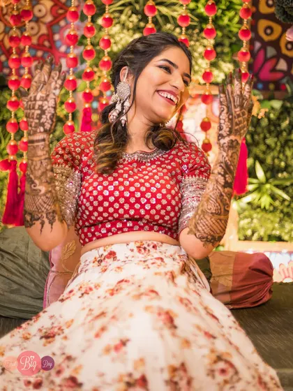 The pure joy and excitement of a Mehendi ceremony. Saumya's laughter is infectious in this candid shot.