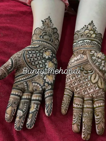 This design combines Arabic-style floral patterns with geometric grids. The name 'Suhaib' is subtly included on one hand.