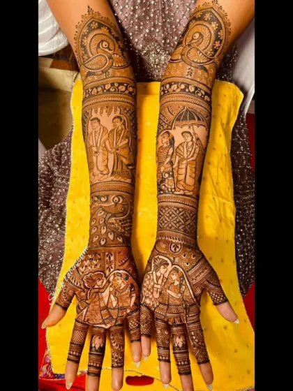 This design captures a sweet moment between the couple on the palms, framed by traditional peacock and floral patterns. The forearms continue the story with scenes from the wedding ceremony.