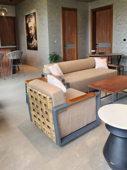 Inside a recently completed hotel project in Bhubaneswar. Our furniture solutions extend to semi-outdoor spaces, with this lounge featuring a mix of woven and upholstered sofas and bar stools.