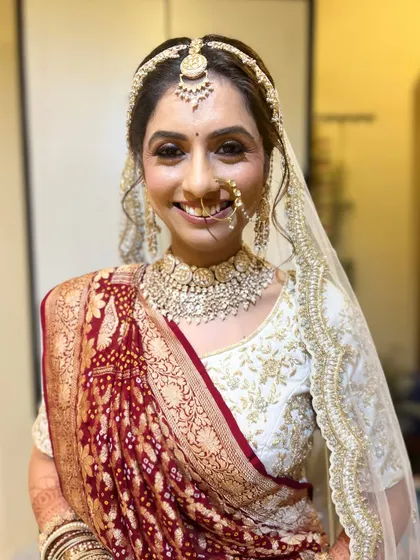 A smiling portrait of the bride, looking radiant and happy.