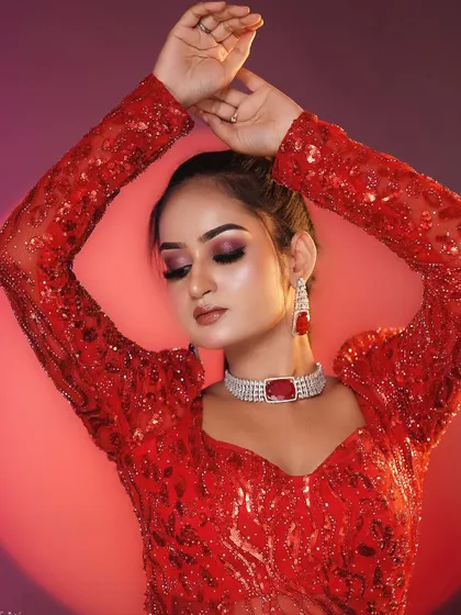 A stunning red gown look created in my one-day makeup masterclass. The smokey eye and bold lip create a dramatic effect.