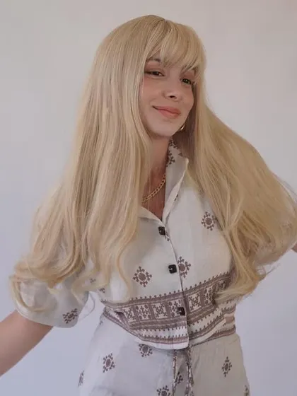 A 50-inch long blonde wig with bangs, made with HD lace. This is a statement piece for anyone wanting to make a bold impression.