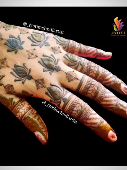 A unique and modern design with lotus motifs scattered across the back of the hand, creating a pattern that is both simple and eye-catching.