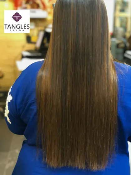 This back view emphasizes the length and health of the hair after our balayage and Botox service. The gold chocolate tones are rich and warm, giving the hair a luxurious and polished appearance.