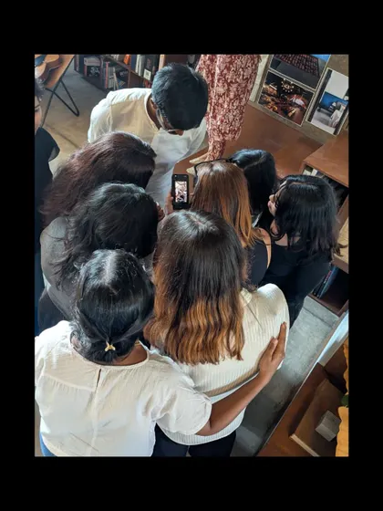 Trying to get the perfect group selfie is always a team effort.
