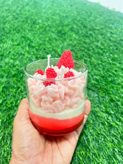 A perfectly layered strawberry parfait candle, handcrafted by a guest in our workshop.