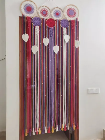 Another look at our custom macrame curtain, showing its full length and the beautiful tassels at the bottom.