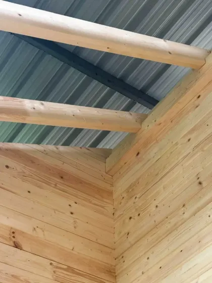 A close-up of the joinery and roof structure during the treehouse mockup review. This level of detail is crucial for ensuring the final construction is both durable and aesthetically refined, blending traditional woodcraft with modern prefabrication.