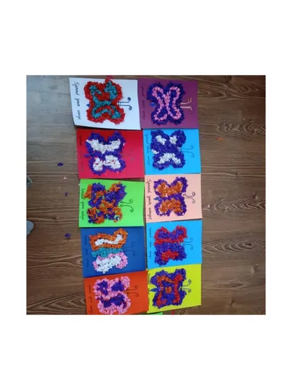 A beautiful collection of butterfly art made by the children. This craft involved tearing and pasting small pieces of paper, an excellent activity for strengthening the small muscles in their hands.