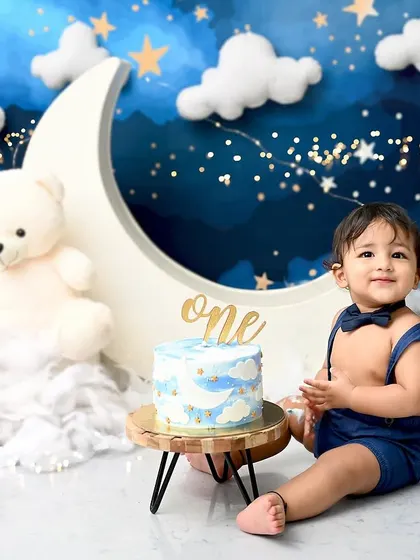 Another sweet moment from the starry night cake smash. His gentle smile and smart bowtie make this an incredibly charming birthday portrait.