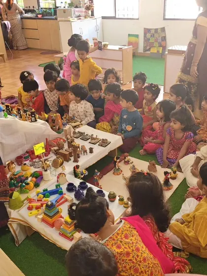 Storytelling and learning around the 'Golu' display.