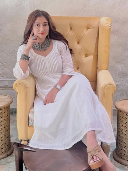 Relaxing in style. Gungun poses in our comfortable salon chair after her hair and nail services, looking effortlessly elegant.