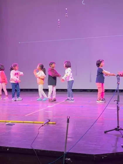 Another shot of our students rehearsing, showing their dedication and the joy they find in performing together.