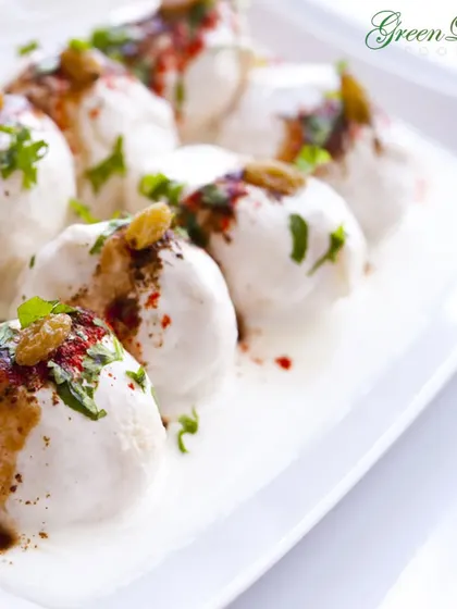 Soft and spongy dahi vadas soaked in creamy yogurt and topped with sweet and spicy chutneys. This classic North Indian chaat is a cooling and delightful addition to any wedding menu, especially for daytime events.