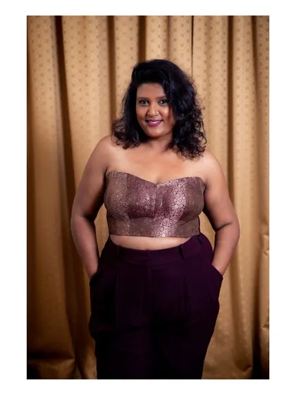 Feeling confident in a custom-made corset. I designed this brocade corset top and paired it with tailored trousers for a modern, edgy look. I can create bespoke corsets and western wear that fit you perfectly.