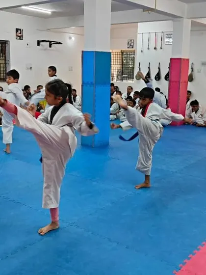 A student executes a high kick.