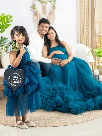 "Baby on Board!" We love using cute props like this sign to announce the wonderful news. This family maternity shoot is full of anticipation and joy.