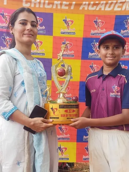 A player from the U-12 division receives the Man of the Series trophy, a prestigious award for the most impactful player in the tournament.