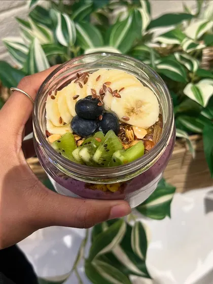 A nutritious and delicious smoothie bowl from Fuel by Urban Fork, topped with fresh fruit and granola.