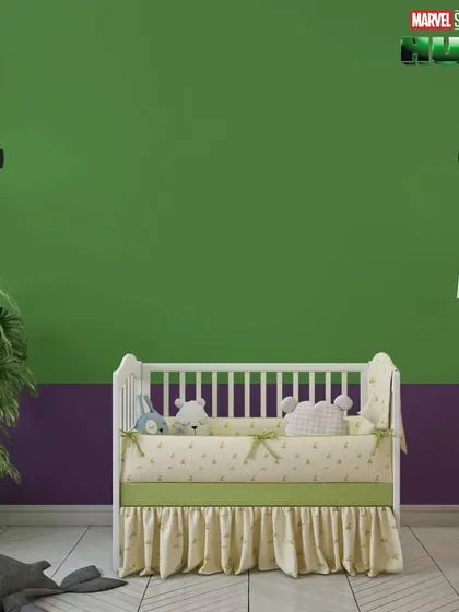 A simple but effective Hulk-themed room with a green and purple two-tone wall and the iconic Hulk fists.
