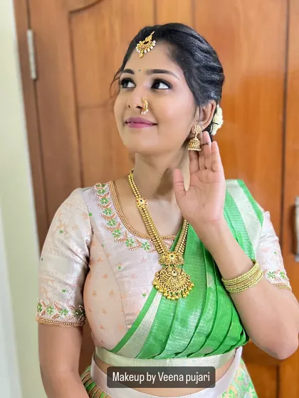 A beautiful profile of Swathi Reddy. Her makeup is fresh and radiant, perfect for a daytime family function.