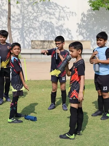Players listen to instructions during a break in a DFA League game.