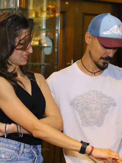 A close-up on the handhold and connection between two dancers. This detailed shot emphasizes the technique and partnership involved in social dancing.