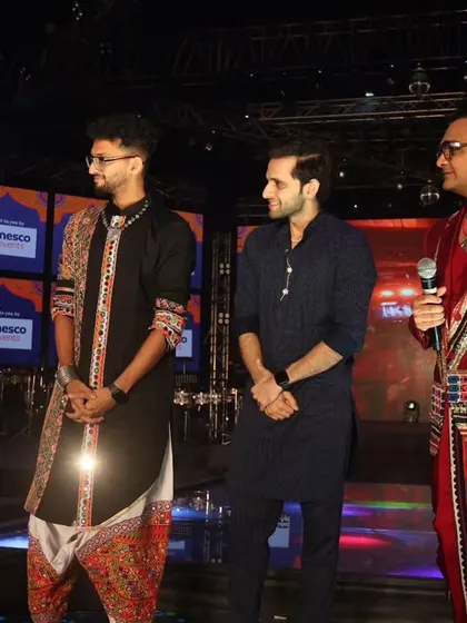 Listening intently during a guest segment at Navratri. As a host, it's crucial to be an active listener, guiding the conversation naturally and ensuring a smooth flow.