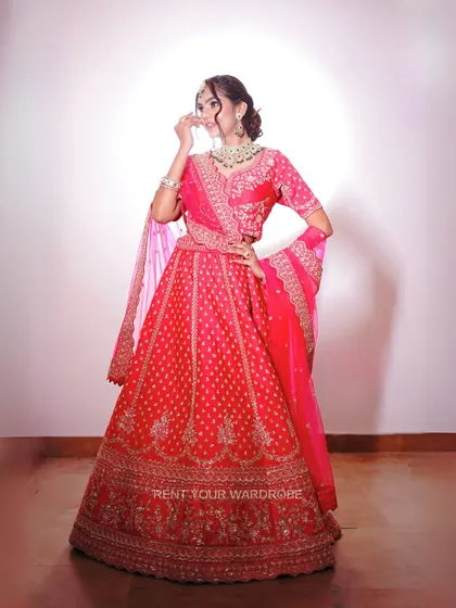 A full-length view of the bright pink lehenga, a classic choice for any wedding celebration.
