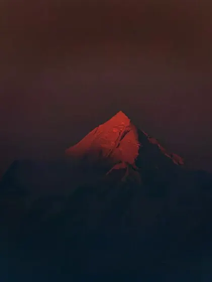 The last rays of the setting sun kiss a single peak in Ranikhet, turning it a fiery red. This fleeting moment, captured with my Canon 80D, shows the dramatic, painterly light the mountains offer.