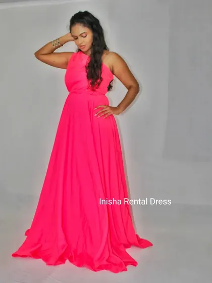 This vibrant hot pink infinity gown is for moms-to-be who want to make a statement. It's a fun, joyful color for your maternity celebration.