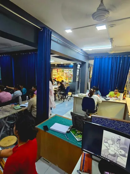 A snapshot of our spacious studio during a full class. With multiple work areas and plenty of inspiration on the walls, it's the perfect environment to learn and create.