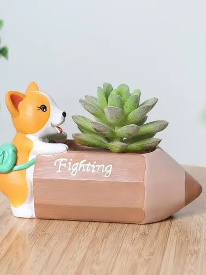 This "Fighting" pencil-shaped planter with a corgi is a fun and motivational piece for any desk. It's a small resin pot perfect for a single succulent.