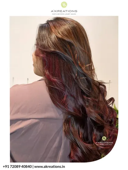 A back view of the magenta-red balayage, showing the seamless blend of colors and the healthy shine of the hair.
